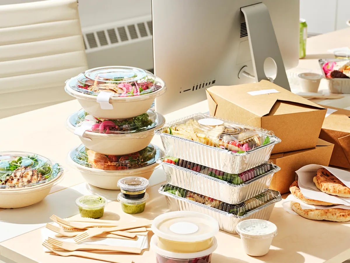 Employees enjoying a group lunch at the office